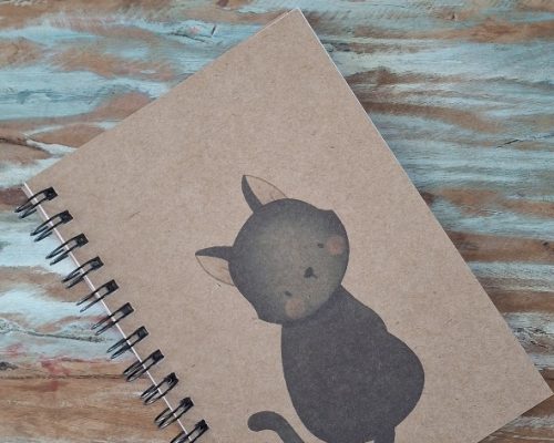 a notebook with a cat on it